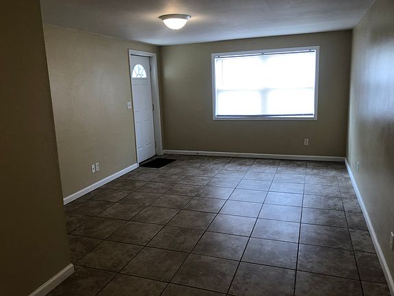 Open living and dining room. Blinds on all windows. Tile floors throughout unit.