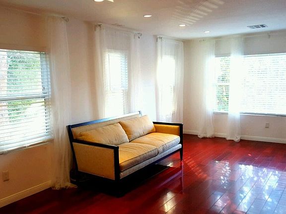 Large Living Space Includes Window Treatments
