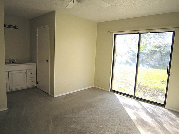  Large master suite with sliding glass door to the backyard. Freshly painted and also carpet has been steam cleaned. Spacious walk-in closet.