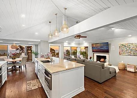 Vaulted ceilings, large center island, wood & gas burning fireplace and stunning ocean views from the main living space.