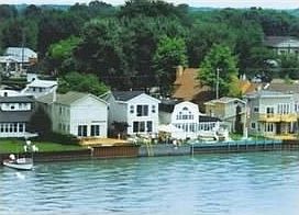 View of Neighborhood
						:
						This property is the one with all the lawn area