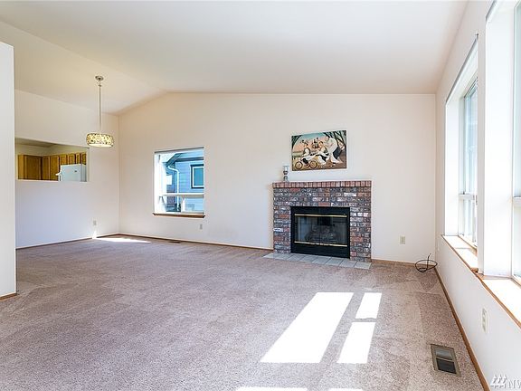 Around the corner is a dining area with pass through opening to keep conversation going even when one must pop into the kitchen. That corner also features fun uplighting!