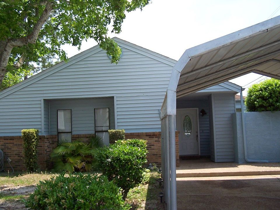 Blue House with 2 car carport