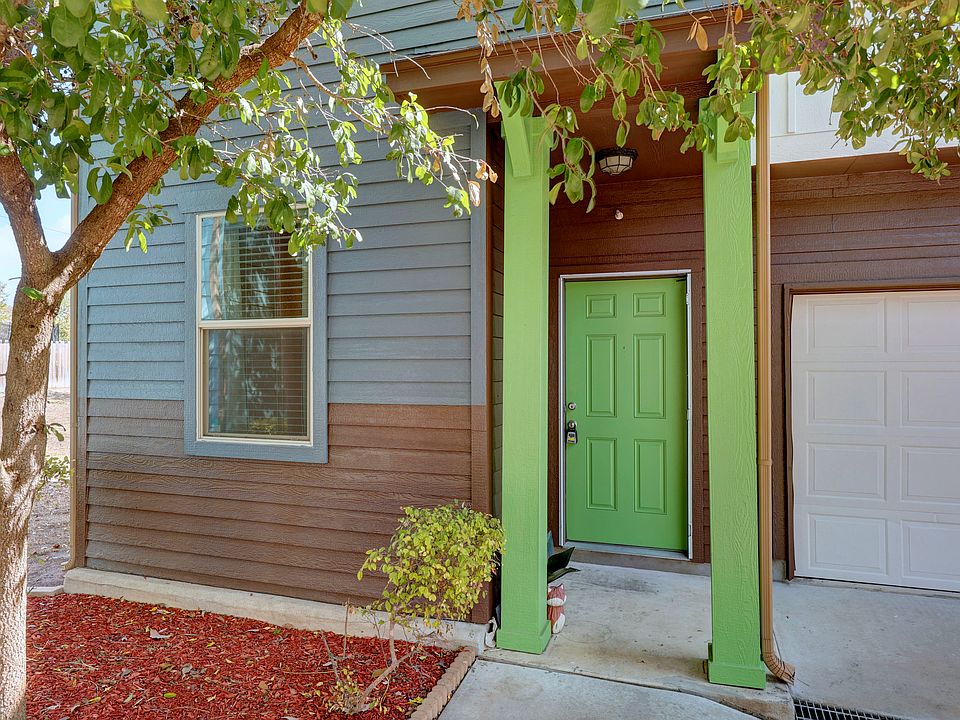 View of exterior entry with a garage