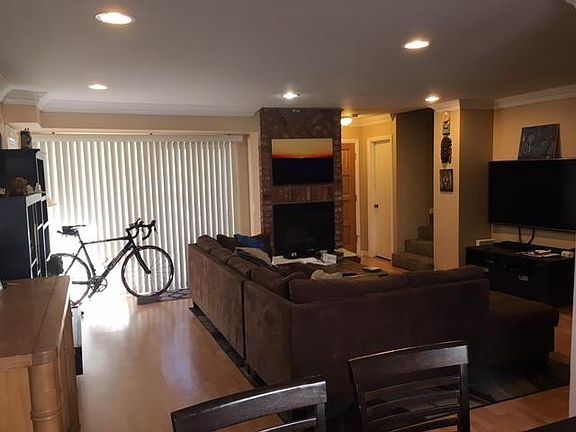 large living area with access to outdoor patio, fireplace