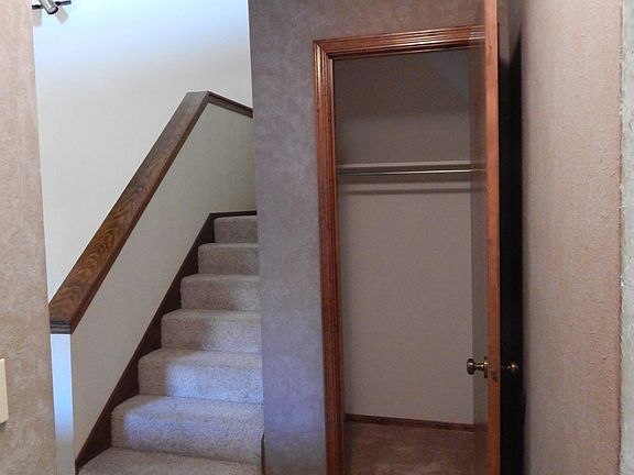 front entranceway closet next to staircase to upstairs