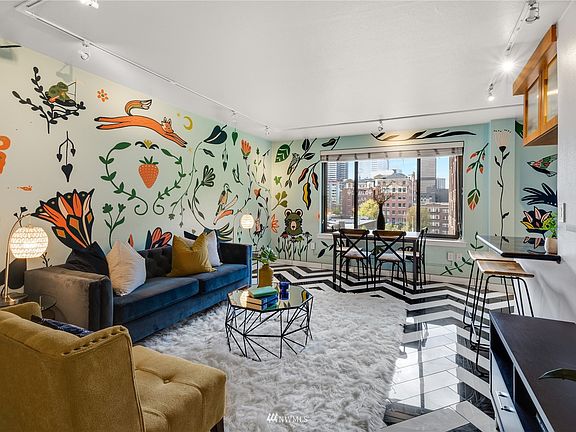 Beautiful mural by Wide Eyed contributes to this home's "one of a kind" factor