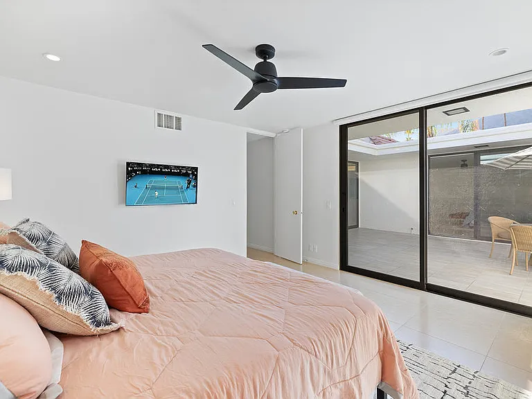 GUEST BEDROOM SUITE HAS COURTYARD ACCESS, SHOWER OVER TUB