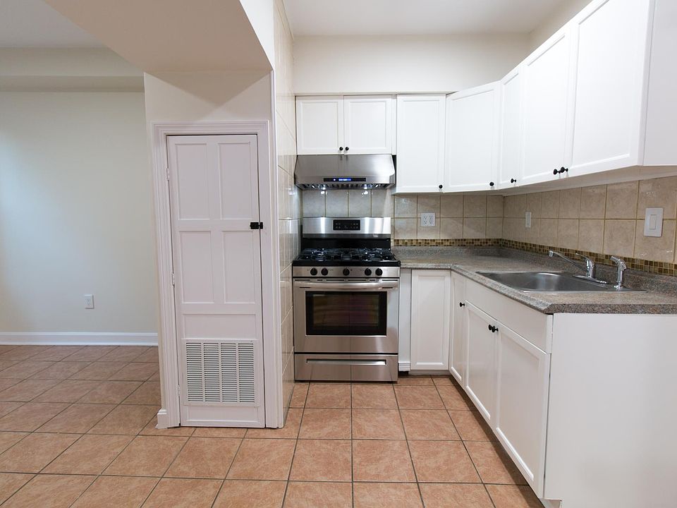 Modern Kitchen with Brand New Range Hood and and Gas Range