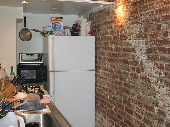 galley kitchen with full-size appliances