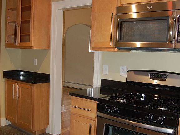 Stainless Appliances, Granite Countertops, Porcelain Tile Floors