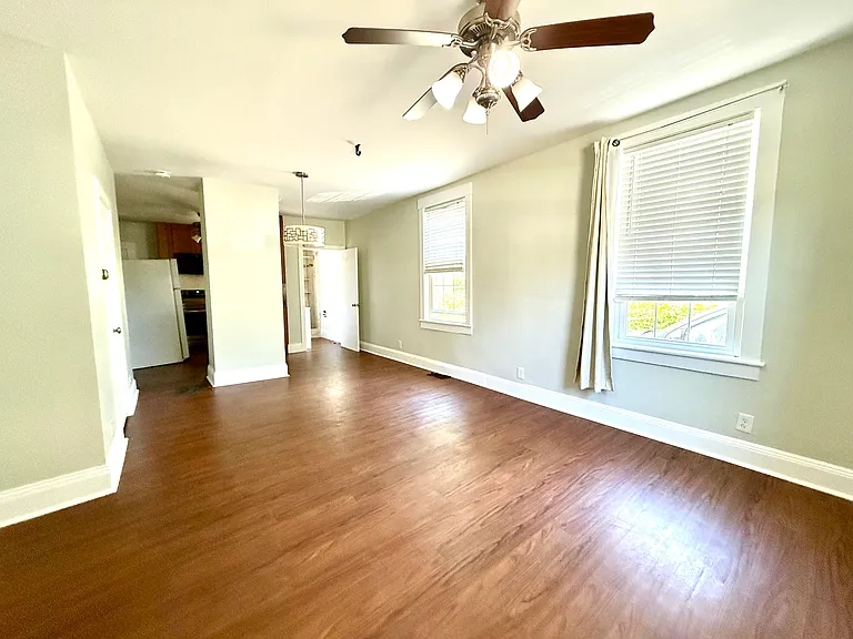 Living room -view to kitchen and bath at far end.