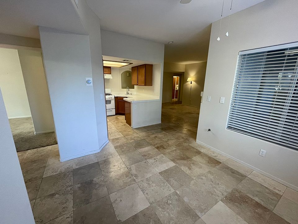 Dining area looking into the kitchen and living room. 3rd bedroom is off to the left.