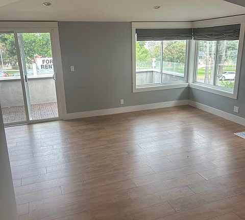 Living room leading to outdoor balcony- facing Polliwog Park