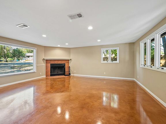 Large living area with stained concrete floor