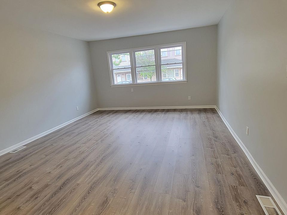 Living room, looking at front windows from front door