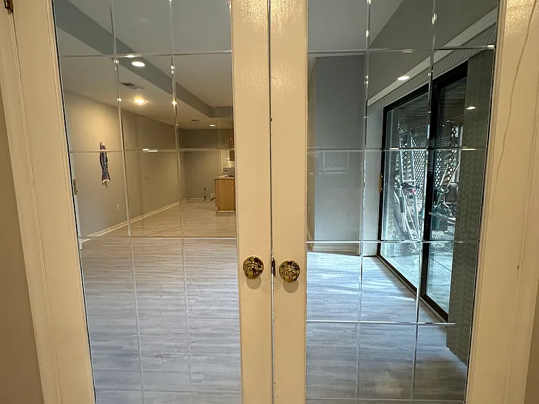 Double French door separates kitchen, dining room from living room and bedrooms.