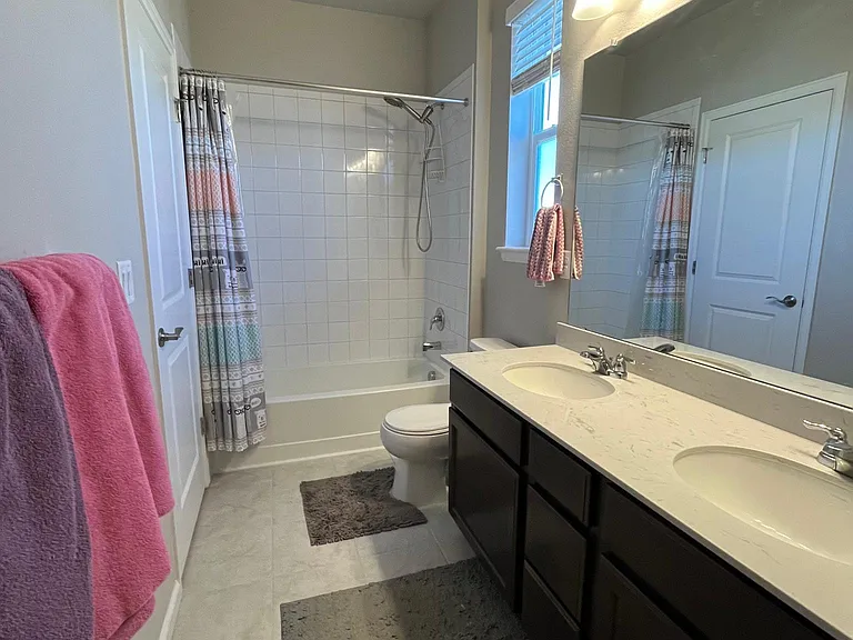Jack and Jill bathroom connecting bedrooms 2 & 3.