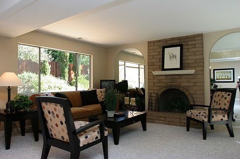 Open family room with wood burning fire place