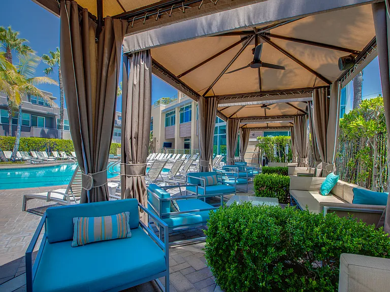 Leisure comes comfortably under the pool cabanas