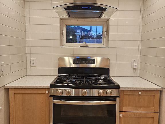 Gas stove with double oven.