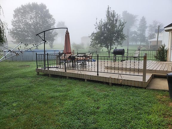 Large deck, brand new railing. Also 27 ft round above ground pool