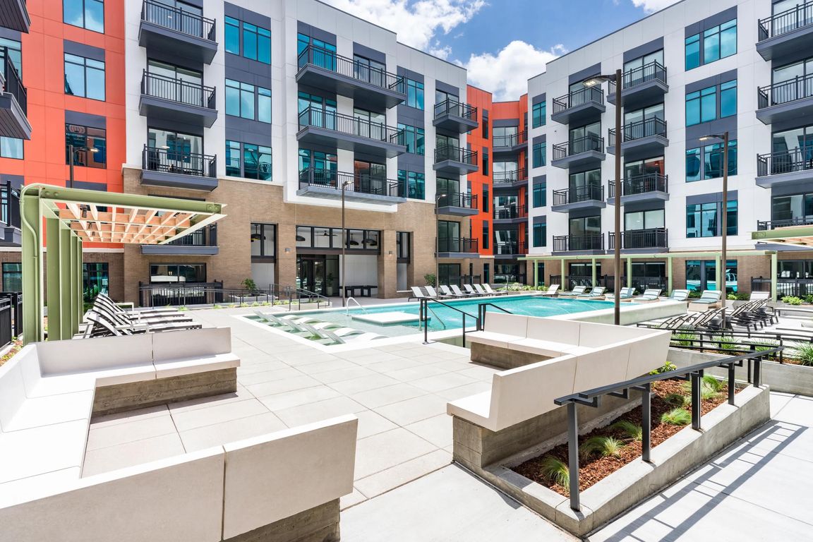 A fresh perspective on downtown leisure _ unwind in the expansive pool courtyard, designed for comfort, connection, and a splash of sun.