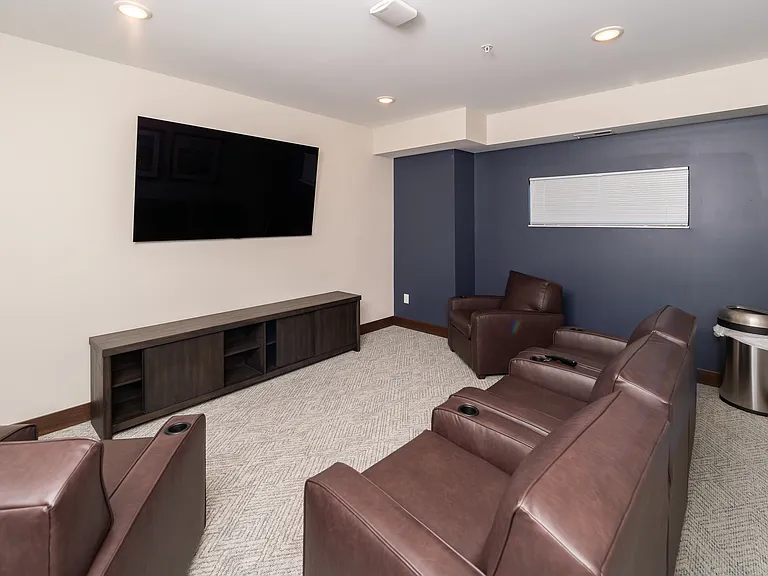 A relaxed lounge with seating and TV for informal hangouts.