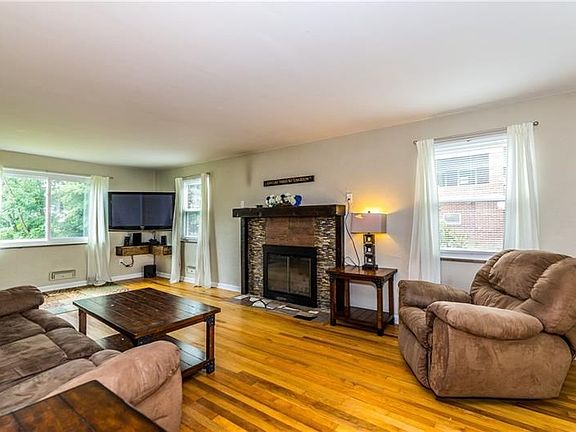 24 x 14 living room with hardwood flooring.