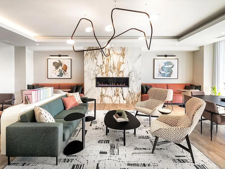 Resident lounge with fireplace and ample seating