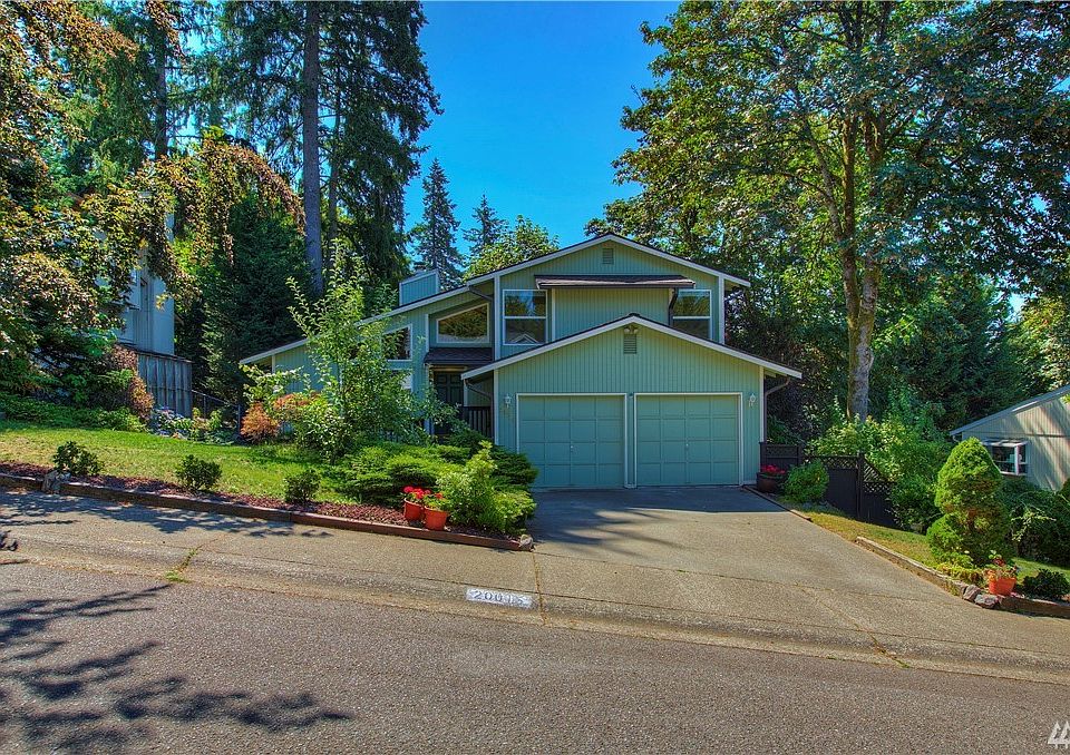 2 car garage with off street parking. This home has a Leaf Guard Gutter System. You will love the greenery in the front. Apple, pear and plum trees.