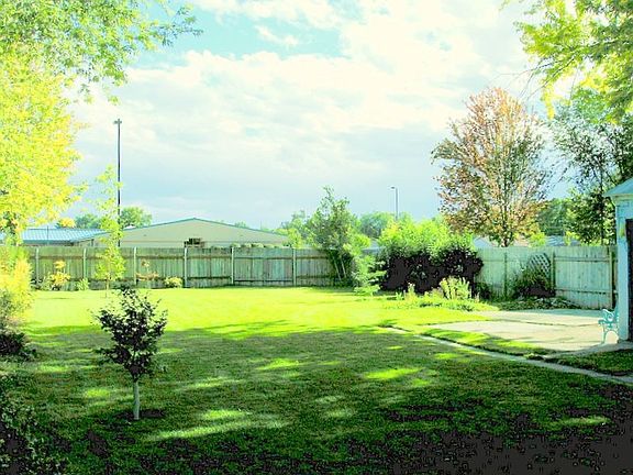 Huge backyard with mature landscaping