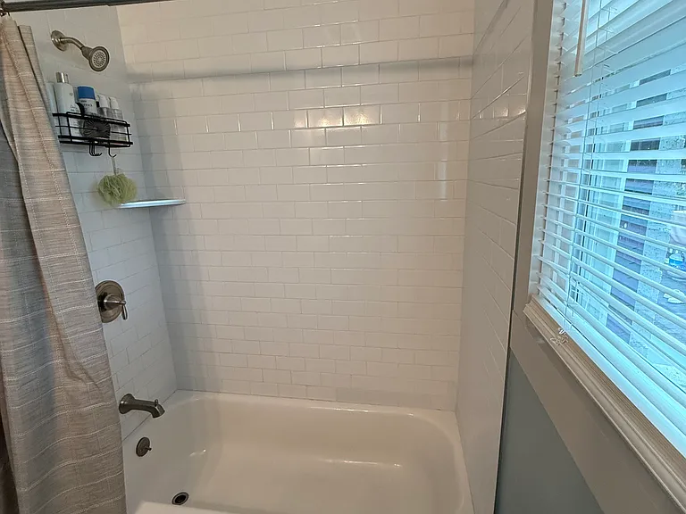 The bathroom walls are being repainted white