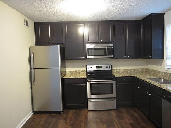 Kitchen with granite countertops and stainless appliances