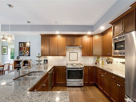 Stunning kitchen with stainless-steel appliances and gas cooking