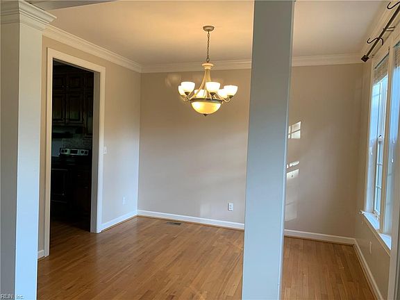 Formal Dining Room - real oak hardwood floors and lovely chandelier