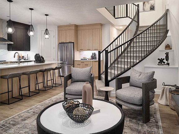 The great room, where elegance and grandeur converge. The focal point A spectacular spiral staircas
