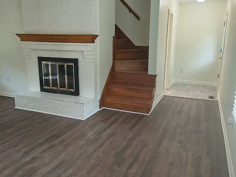Family Room - view to back bathroom and exit to patio. 2nd stairway.
