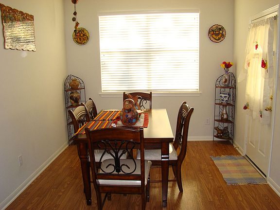 Eat-In Kitchen Overlooks Fenced Backyard