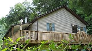 Front of house and deck from lower driveway