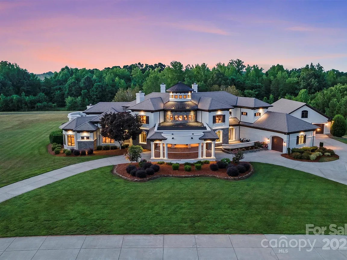 A sprawling Lake Norman estate at 355 Pelham Ln, Mooresville, NC, showcasing modern design and waterfront luxury