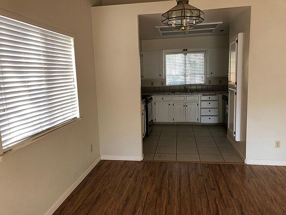Dining room attached to living room looking kitchen