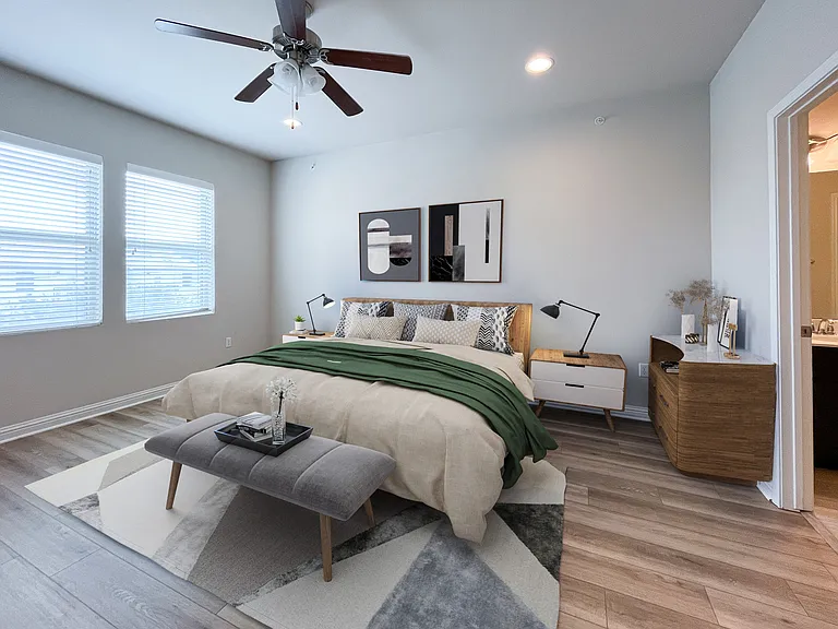 Spacious primary bedroom with king size bed