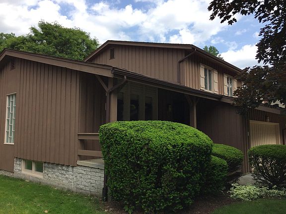 Walking around the side leads to the patio and backyard