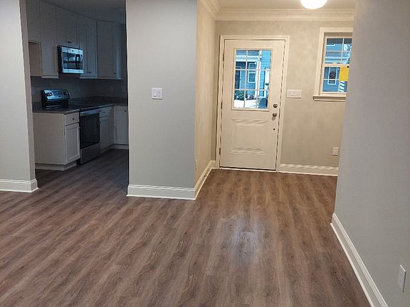 Entryway into Dining/Living Area and exit to Garage