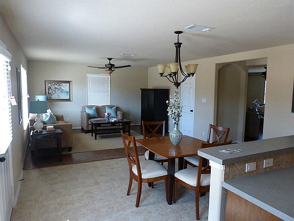 Island kitchen with tile floors opens to eating area and family room! 2" mini blinds! Tile floors! Laminate Wood floors!
