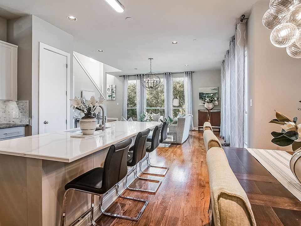 The second floor is flooded with light highlighting the beautiful timeless hard wood floors