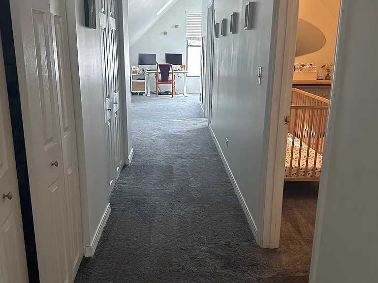 Upstairs hallway, facing bonus space