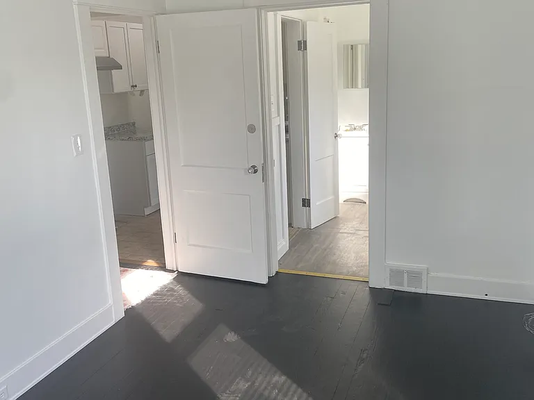 View from front bedroom w/access to bathroom and hallway to kitchen and living room