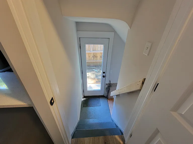 Backyard Entrance and Stairway to Basement